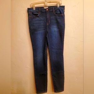 Nicole Miller Studio mid rise, size 12 regular, stretch, dark denim.